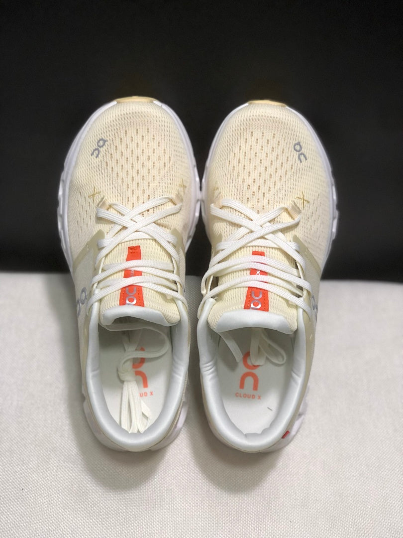 Cream and Orange On Cloud X 4 Sneakers - product image from the listing.