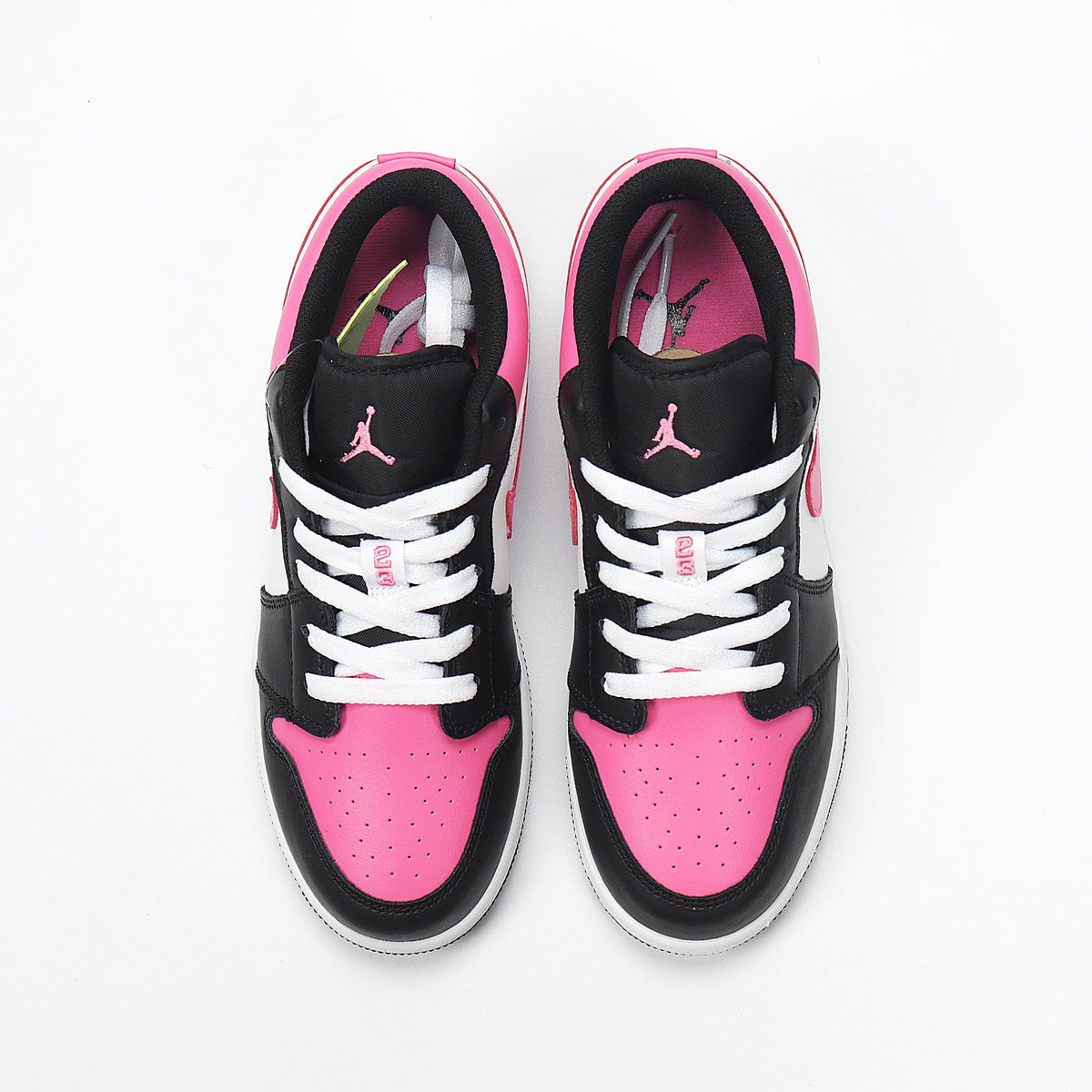 Jordan 1 Low Sneakers in Black Pink White 554723-106 - product image from the listing.