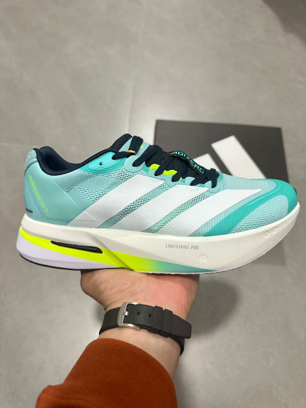 adidas Adizero Lightstrike Pro Running Shoes, in Mint and Black - product image from the listing.