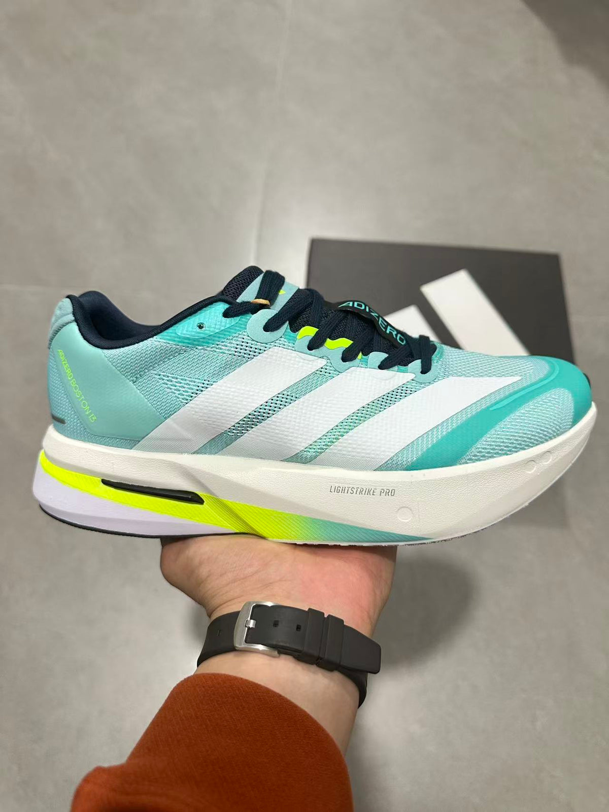 adidas Adizero Lightstrike Pro Running Shoes, in Mint and Black - product image from the listing.