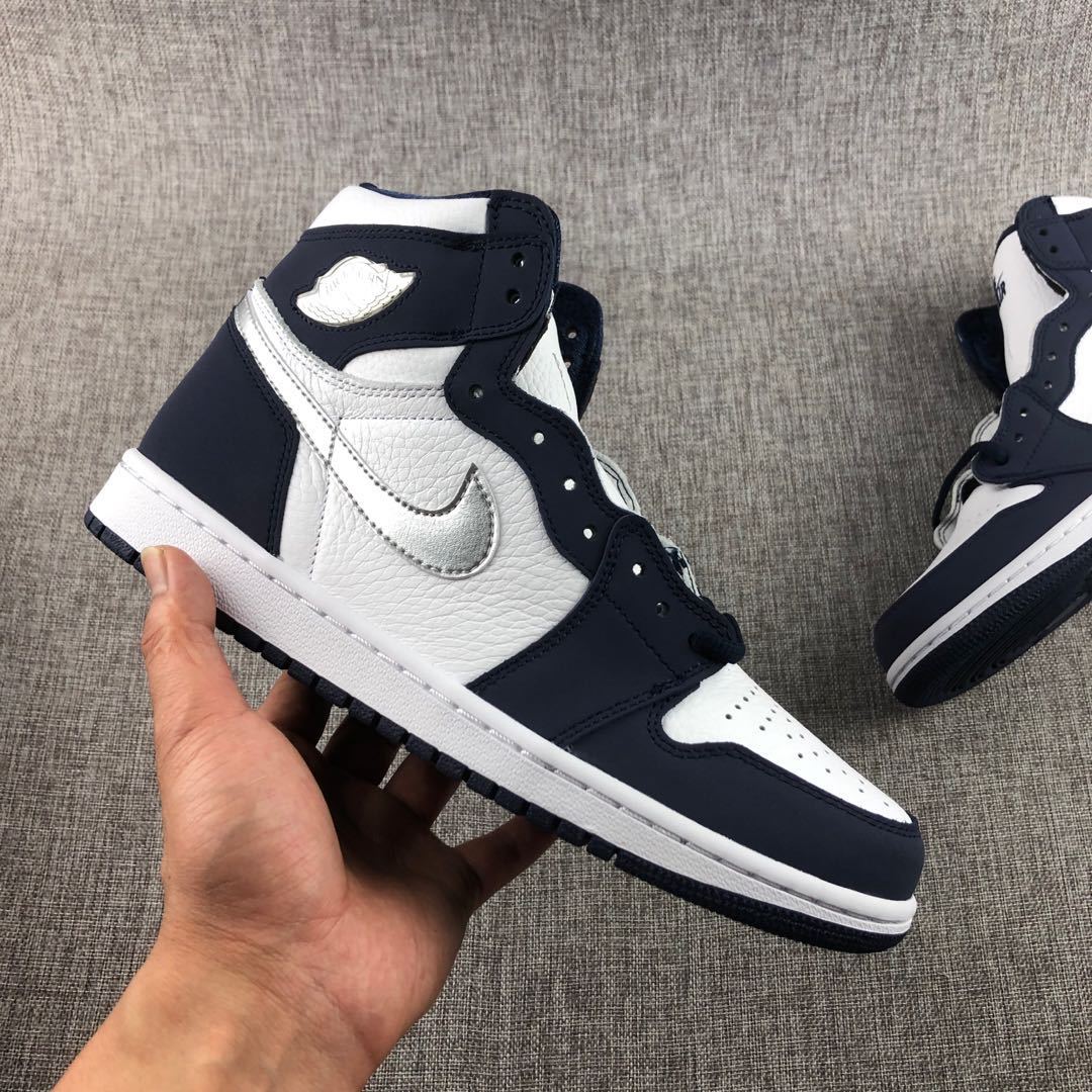 Air Jordan 1 Co.JP High Sneakers White Navy Silver DC1788-100 - product image from the listing.