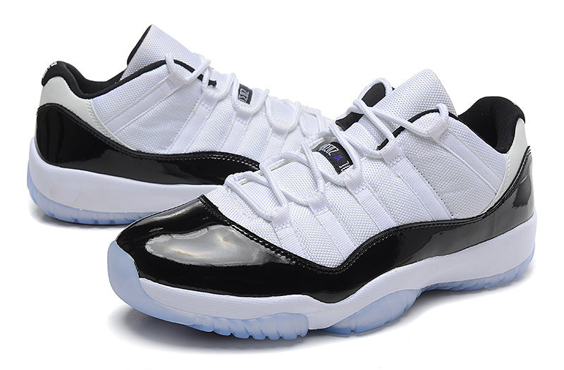 Air Jordan 11 Low Basketball Sneakers in White Black - product image from the listing.