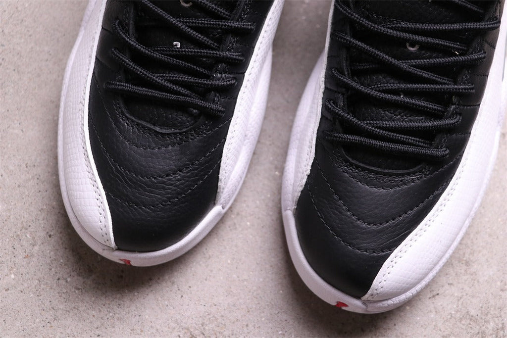 Air Jordan 12 Reverse Taxi Black White 130690-001 - product image from the listing.