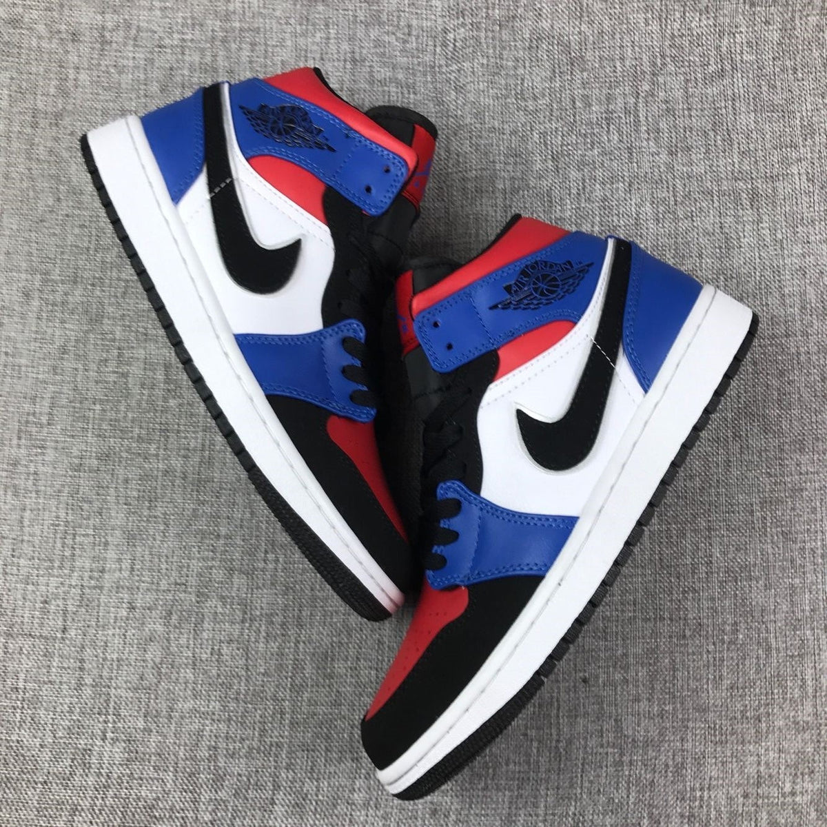 Air Jordan 1 Mid Sneakers in Blue Red Black White - product image from the listing.