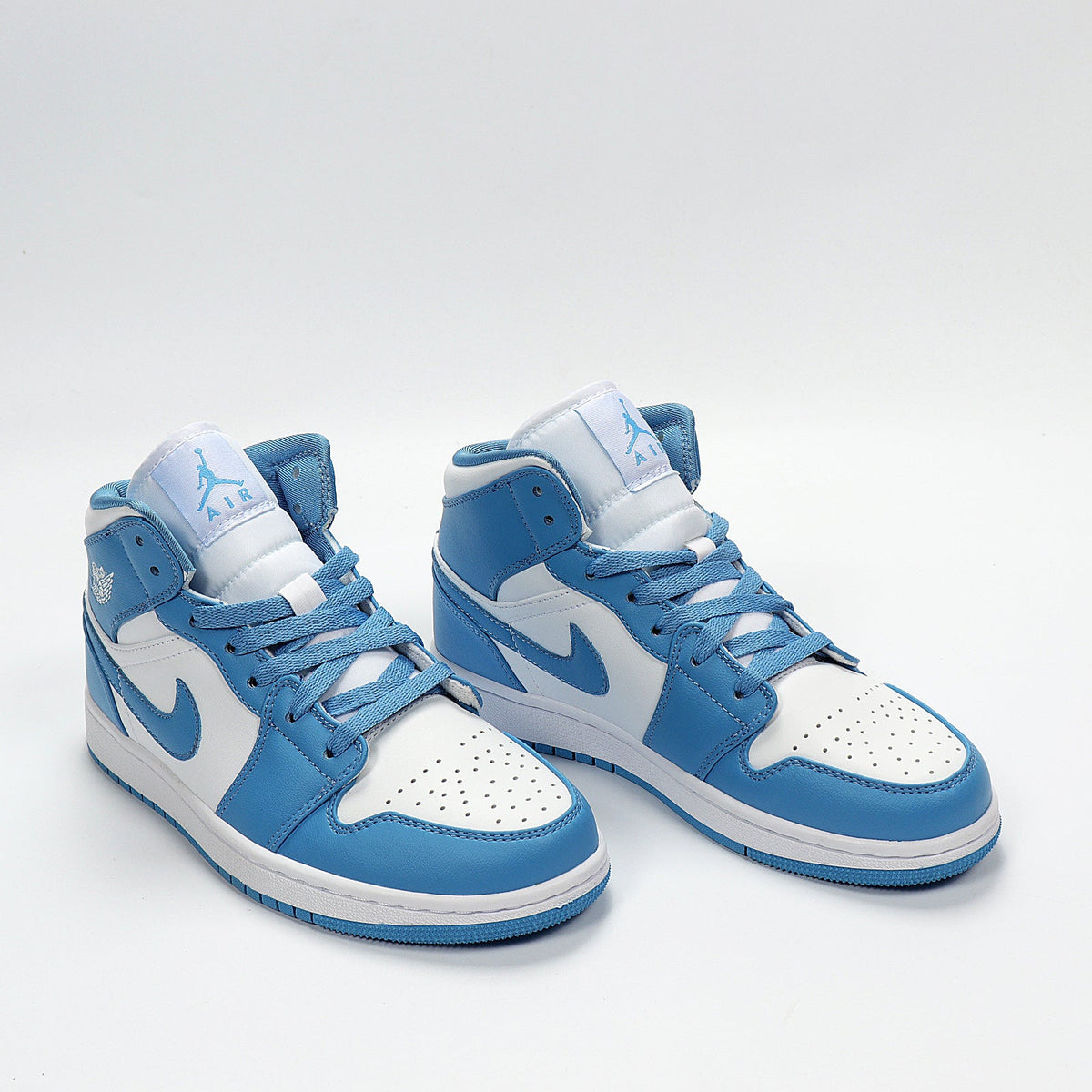 Air Jordan High-Top Sneakers University Blue White 554724-106 - product image from the listing.
