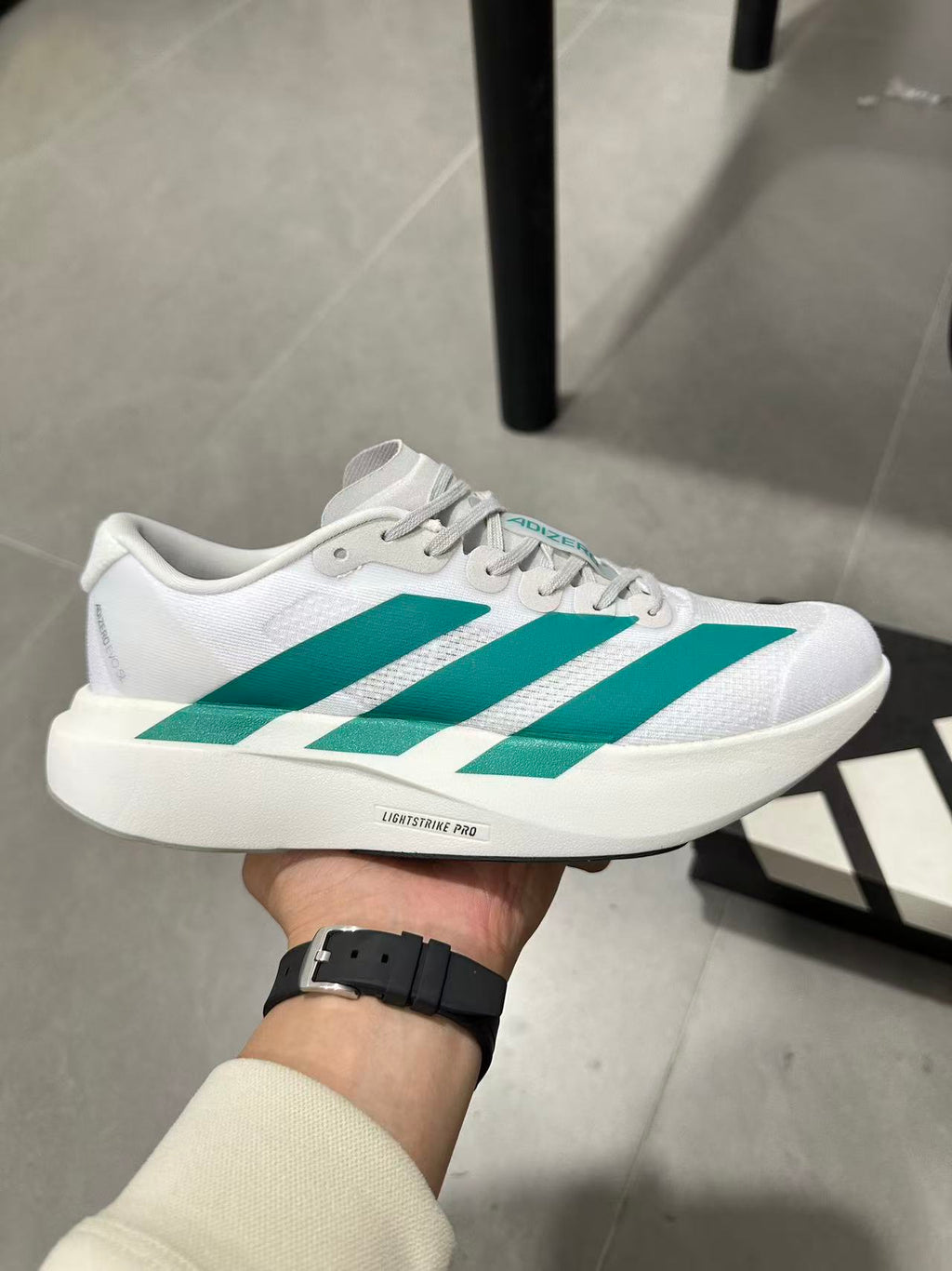 adidas Lightstrike Pro Running Shoes in White and Teal JR4451 - product image from the listing.
