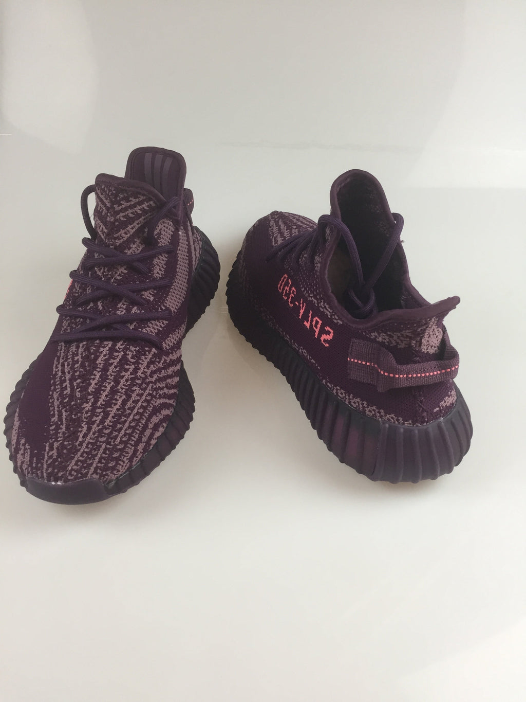 Black and Beige Yeezy 350 V2 Knit Sneakers - product image from the listing.