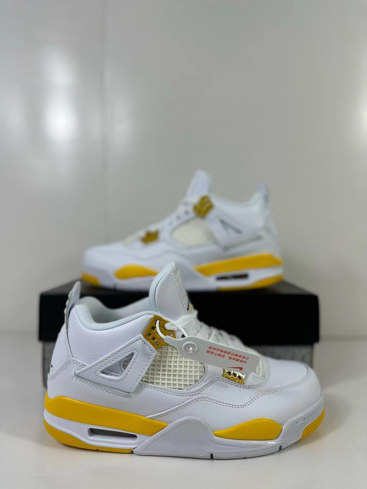 Air Jordan 4 White Yellow Sneakers AQ9129-102 - product image from the listing.