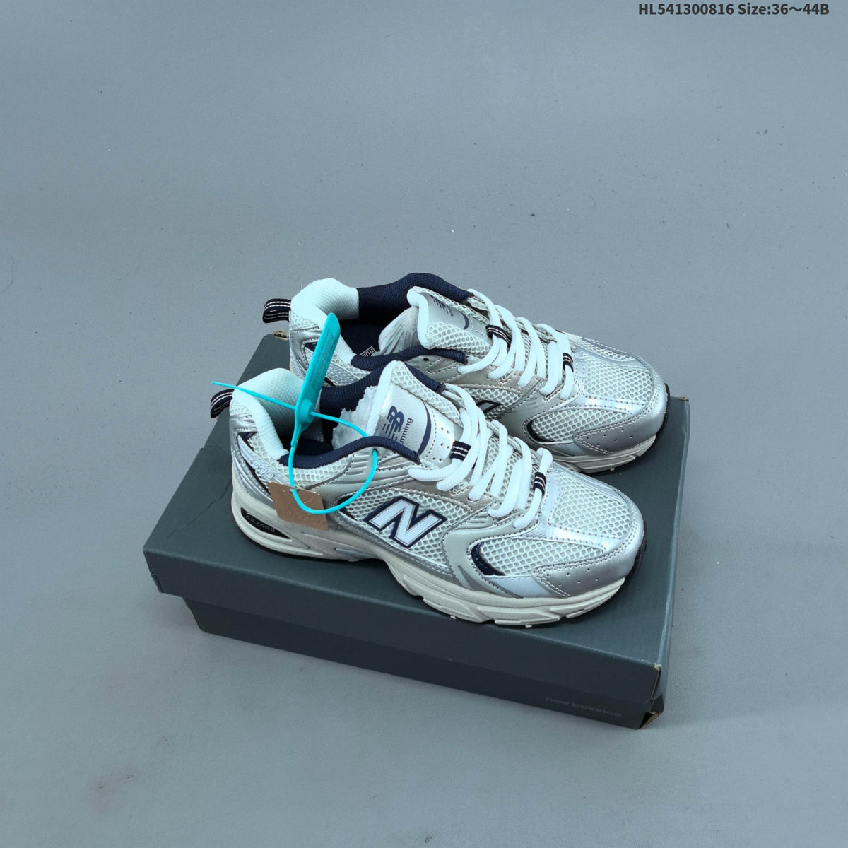 White and Silver New Balance 530-Style Mesh Sneakers - product image from the listing.