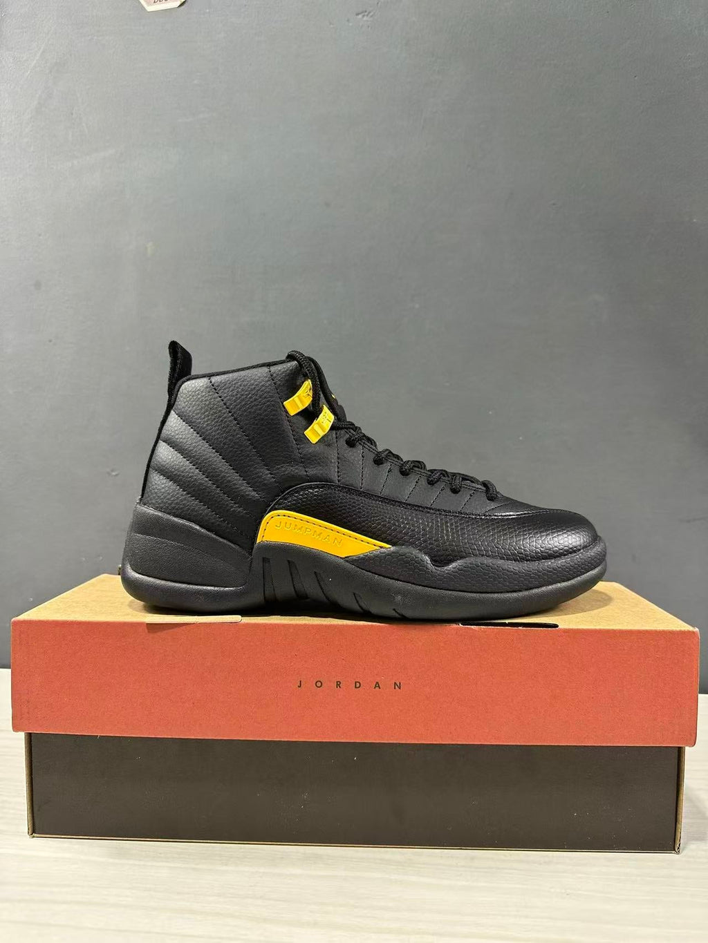 Air Jordan 12 Retro Black Taxi Sneakers CT8013-071 - product image from the listing.