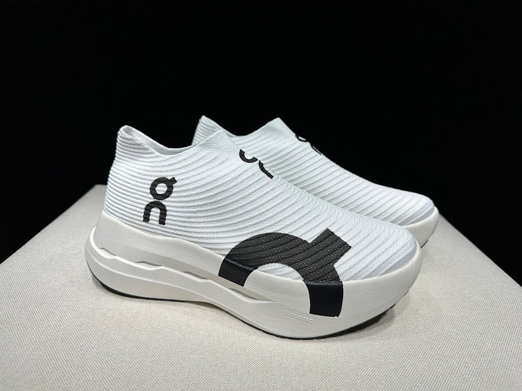On Cloudboom Strike LS Running Shoes in White Black - product image from the listing.
