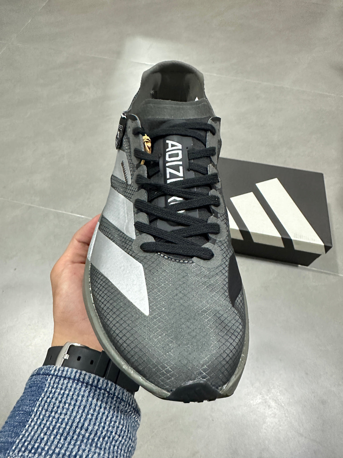 Adidas Adizero Adios Pro 4 Running Shoes in Grey Black - product image from the listing.