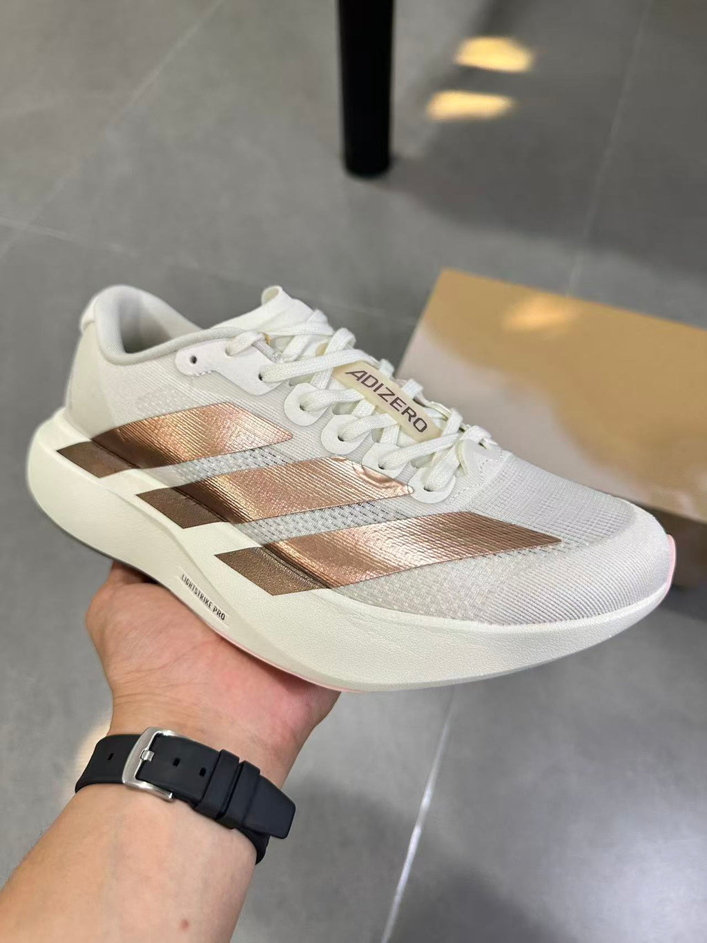Adidas Adizero Lightstrike Pro White Champagne Shoes for Running - product image from the listing.