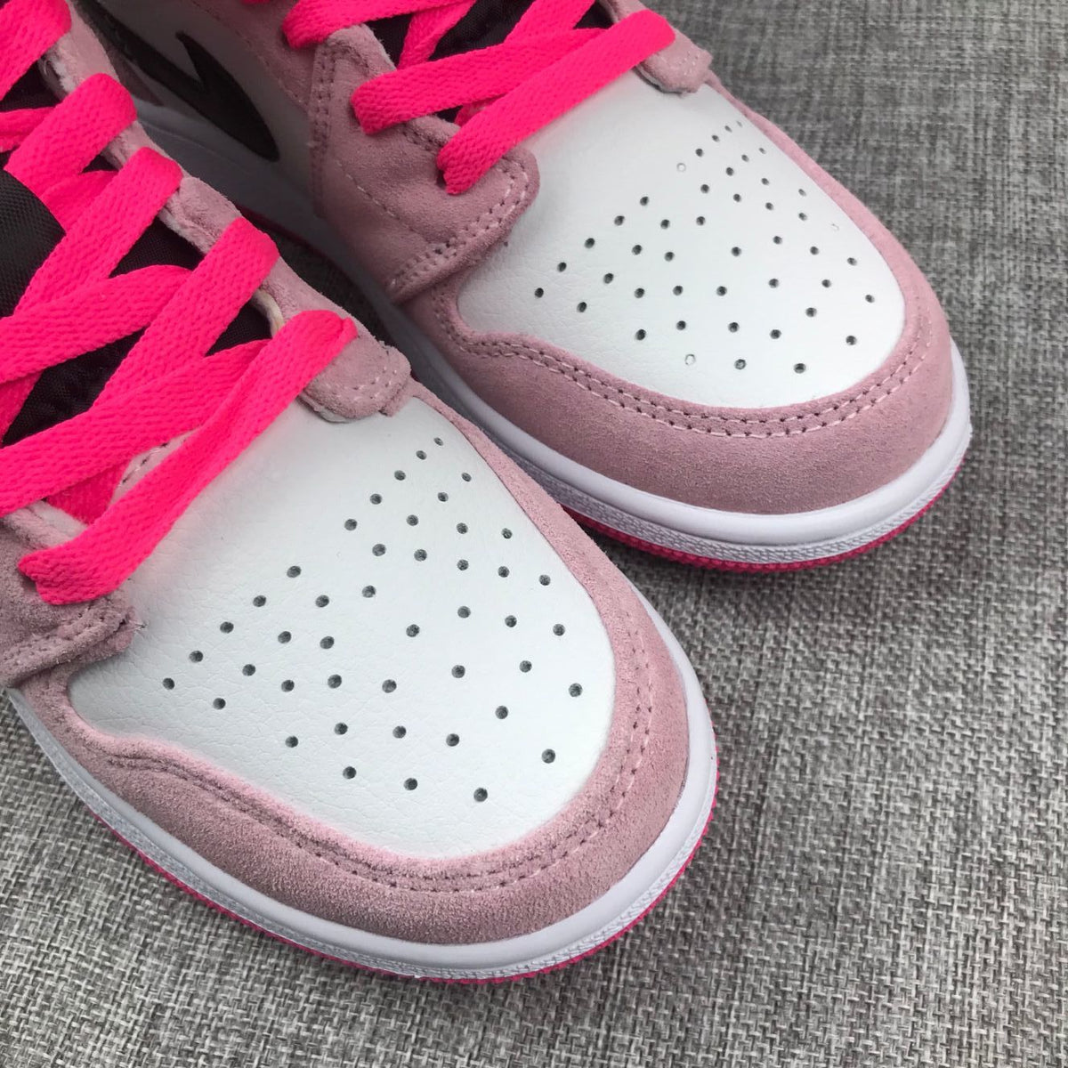 Jordan 1 Mid Sneakers in Pink White Black 852542-801 - product image from the listing.
