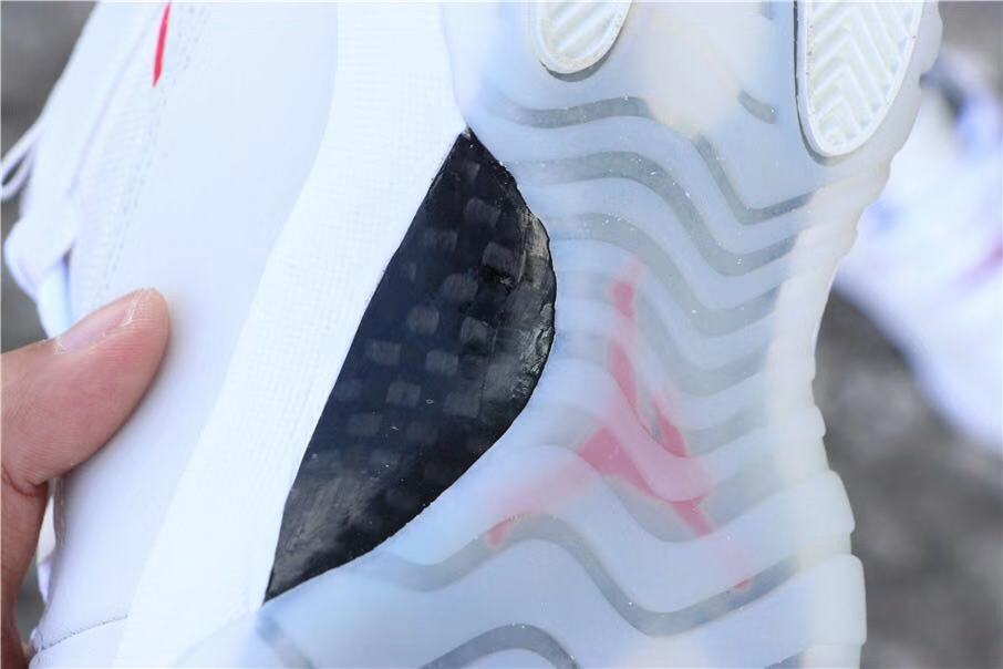 Air Jordan 11 Platinum Tint White High-Top Sneakers - product image from the listing.
