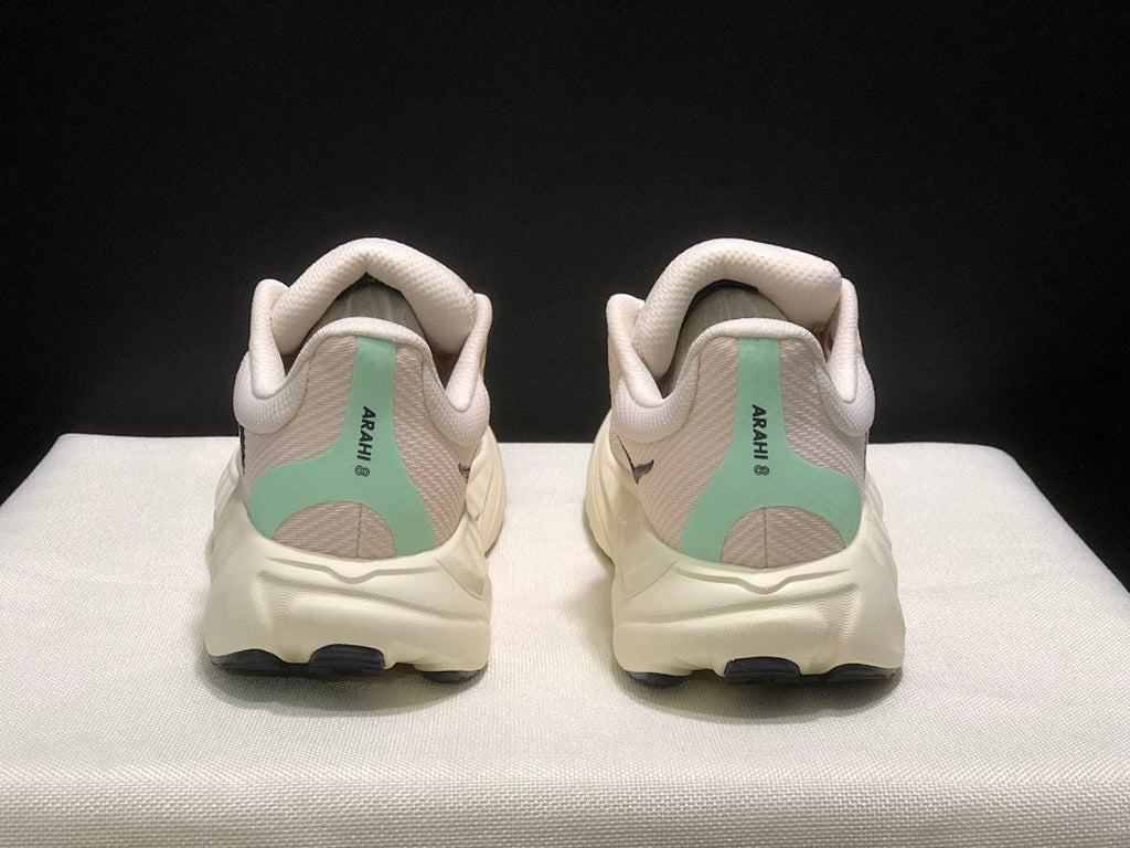 Women's HOKA Arahi 8 Running Shoes, Pink and Mint - product image from the listing.
