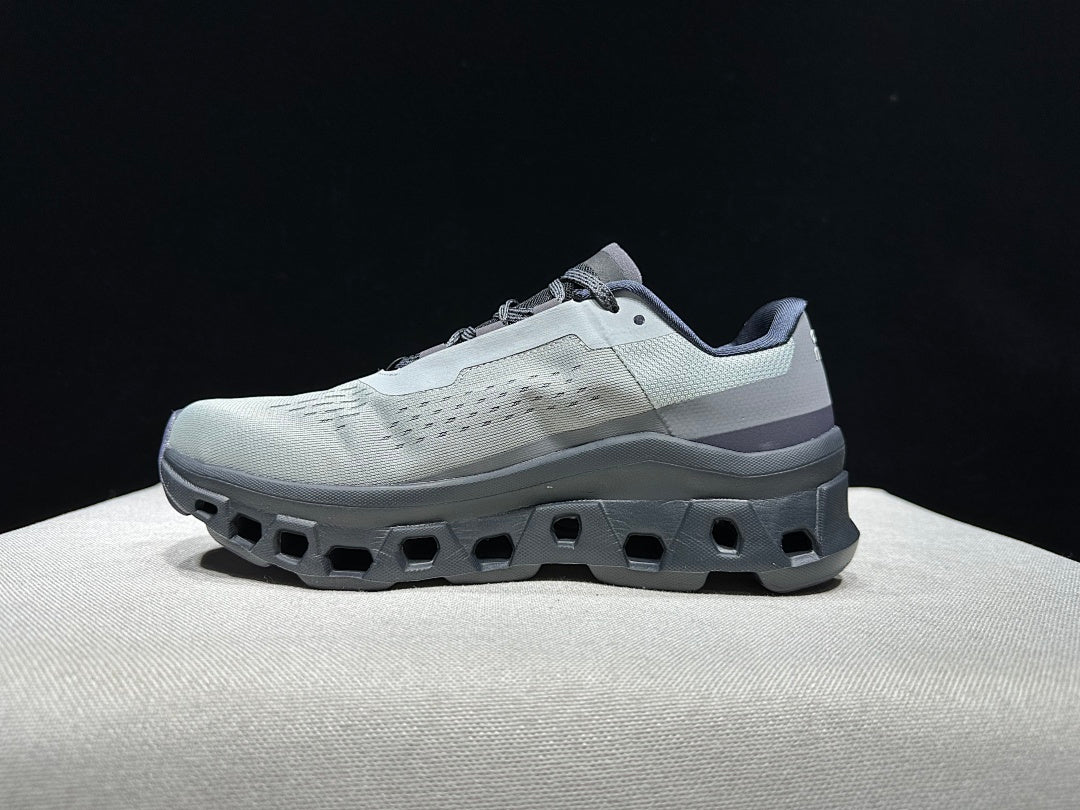 On Cloudmonster Shoes for Running in Eclipse and Magnet - product image from the listing.