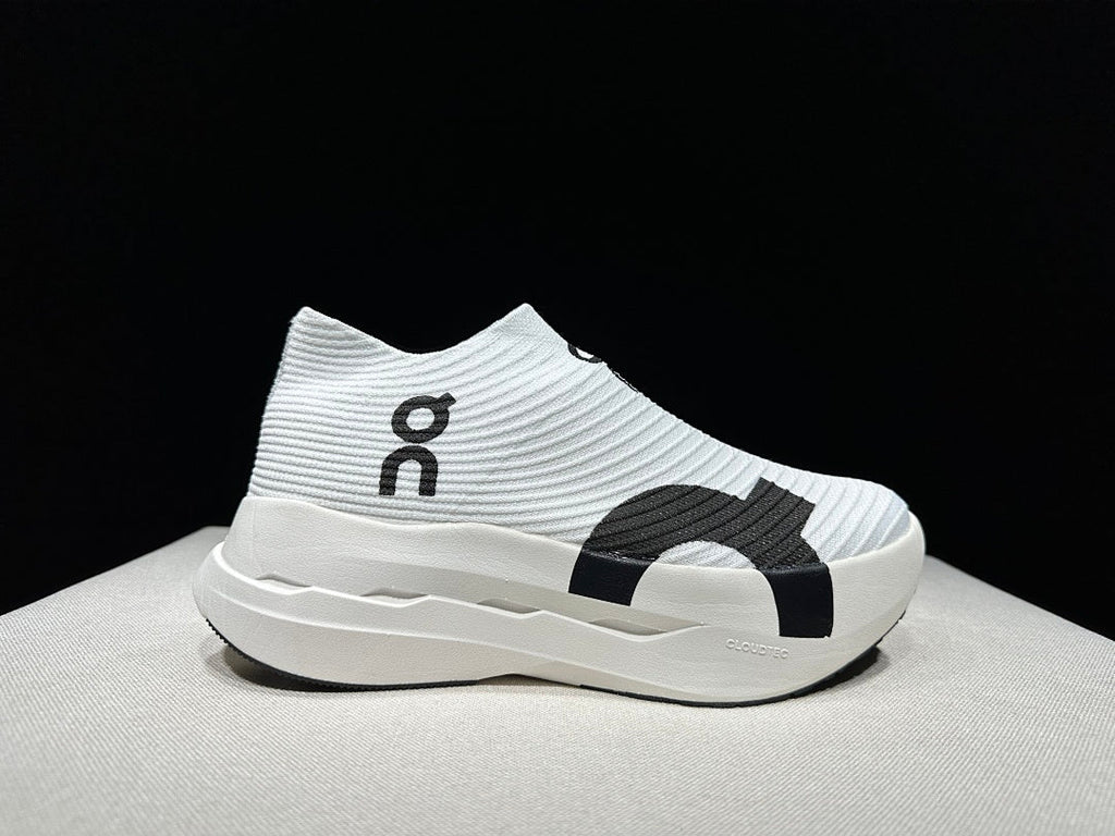 On Cloudboom Strike LS Running Shoes in White Black - product image from the listing.