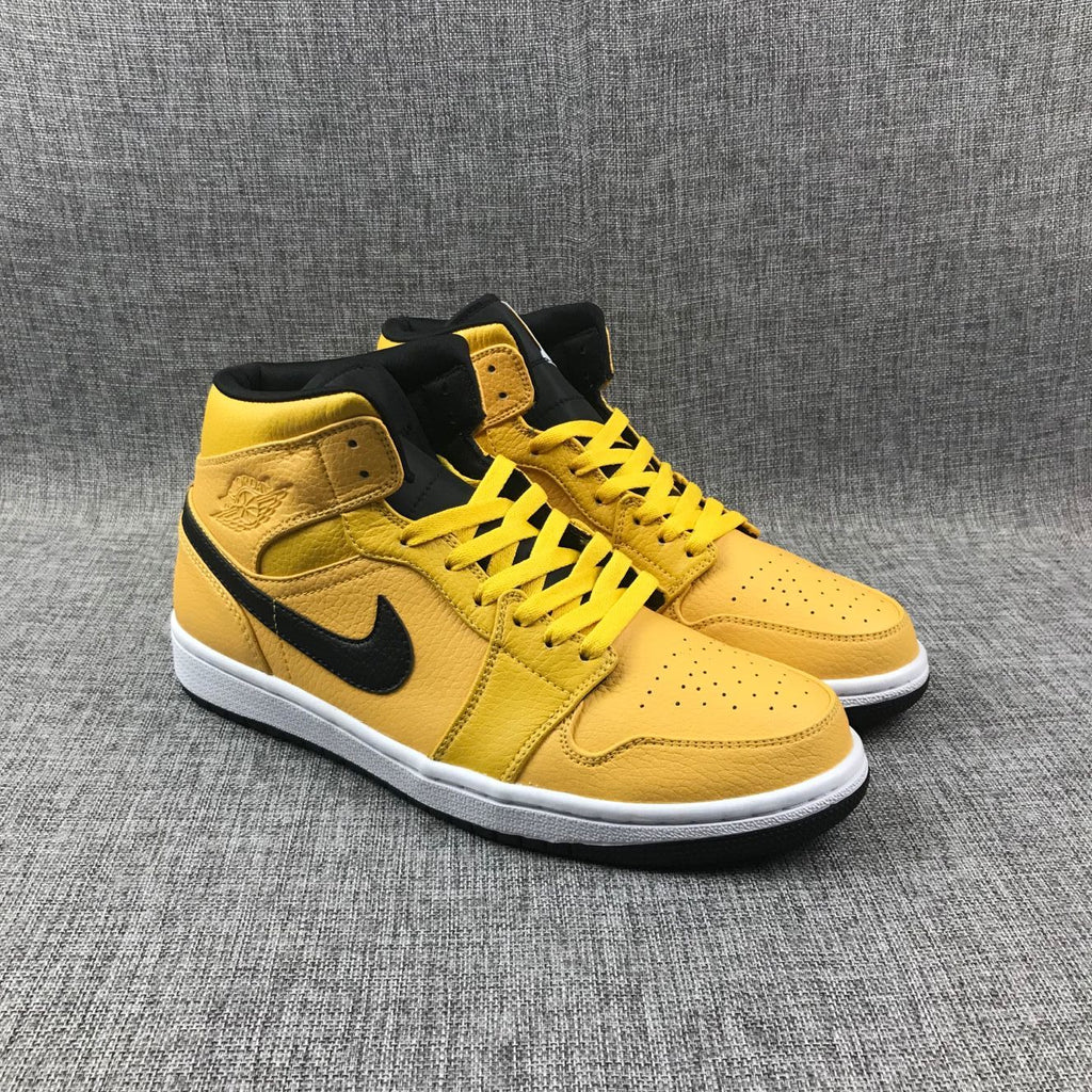 Air Jordan 1 Mid Yellow Ochre Sneakers in Black 554724-700 - product image from the listing.