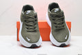 Nike Revolution 8 Running Shoes in Olive Green and White - product image from the listing.