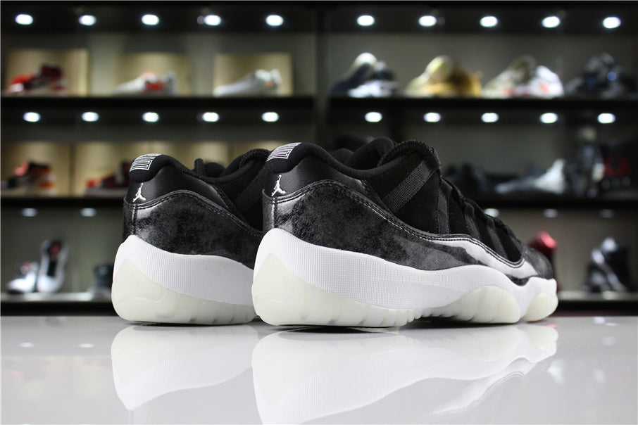 Jordan 11 Retro Low Barons Sneakers in Black White - product image from the listing.