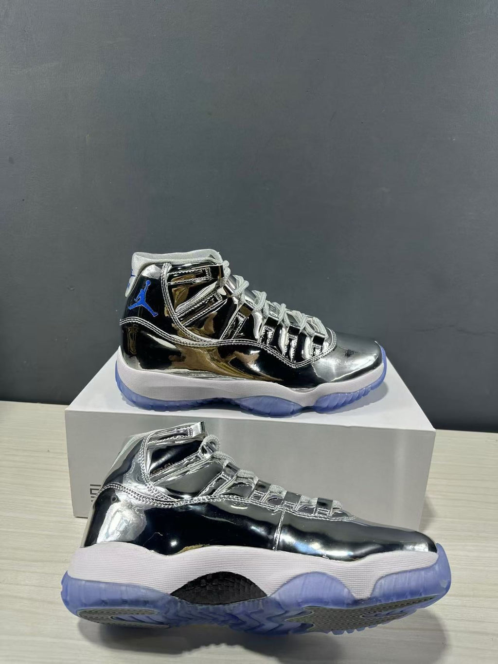Air Jordan 11 Retro Liquid Silver High-Top Sneakers - product image from the listing.