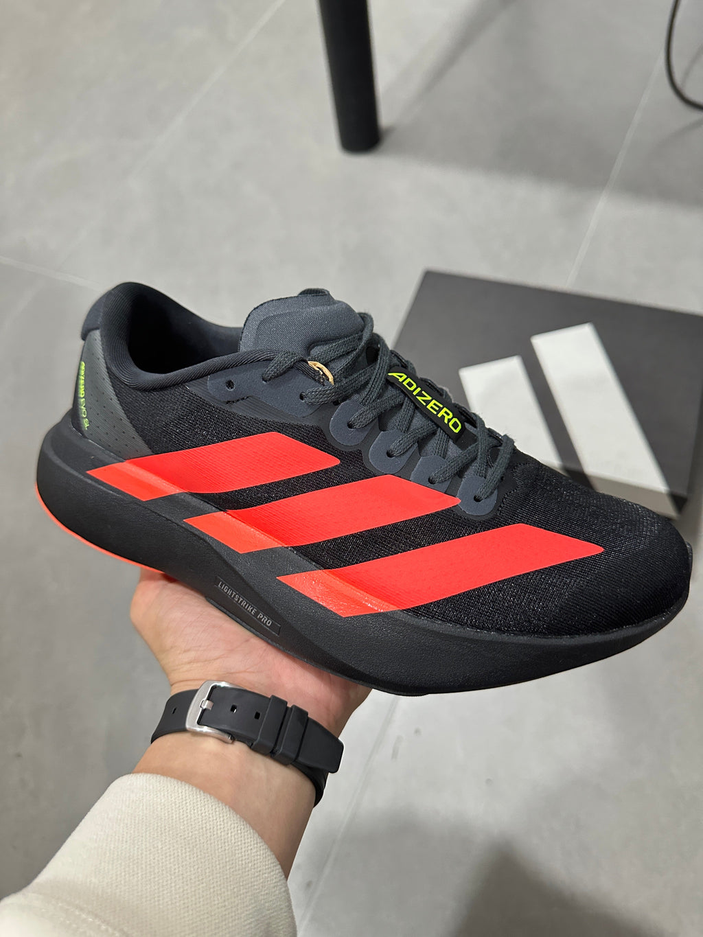 adidas Lightstrike Pro Running Shoes in Black Orange JR3414 - product image from the listing.