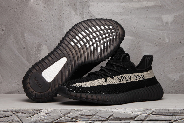 Yeezy 350 V2 Sneakers in Black and Cream - product image from the listing.