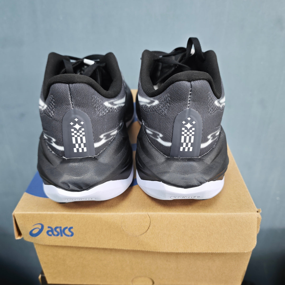 ASICS FF Leap Running Shoes in Black White 1013A177-100 - product image from the listing.