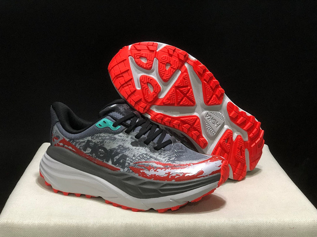 HOKA Stinson 7 Trail Running Shoes in Gray Red - product image from the listing.