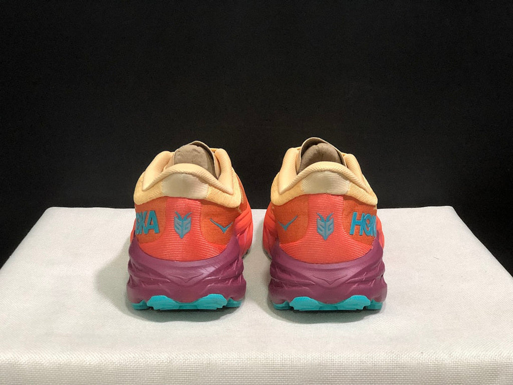 Yellow and Coral HOKA Speedgoat 5 Trail Running Shoes - product image from the listing.