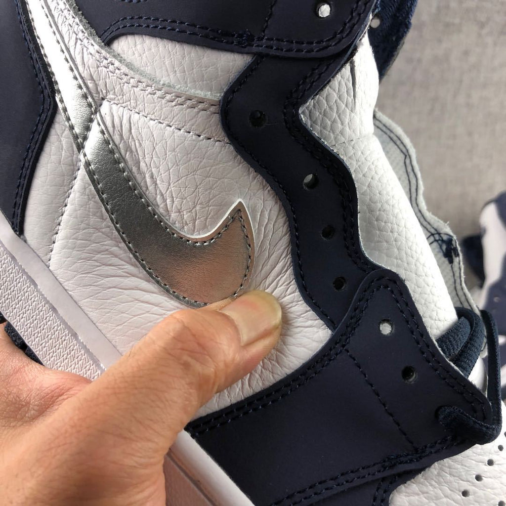 Air Jordan 1 Co.JP High Sneakers White Navy Silver DC1788-100 - product image from the listing.