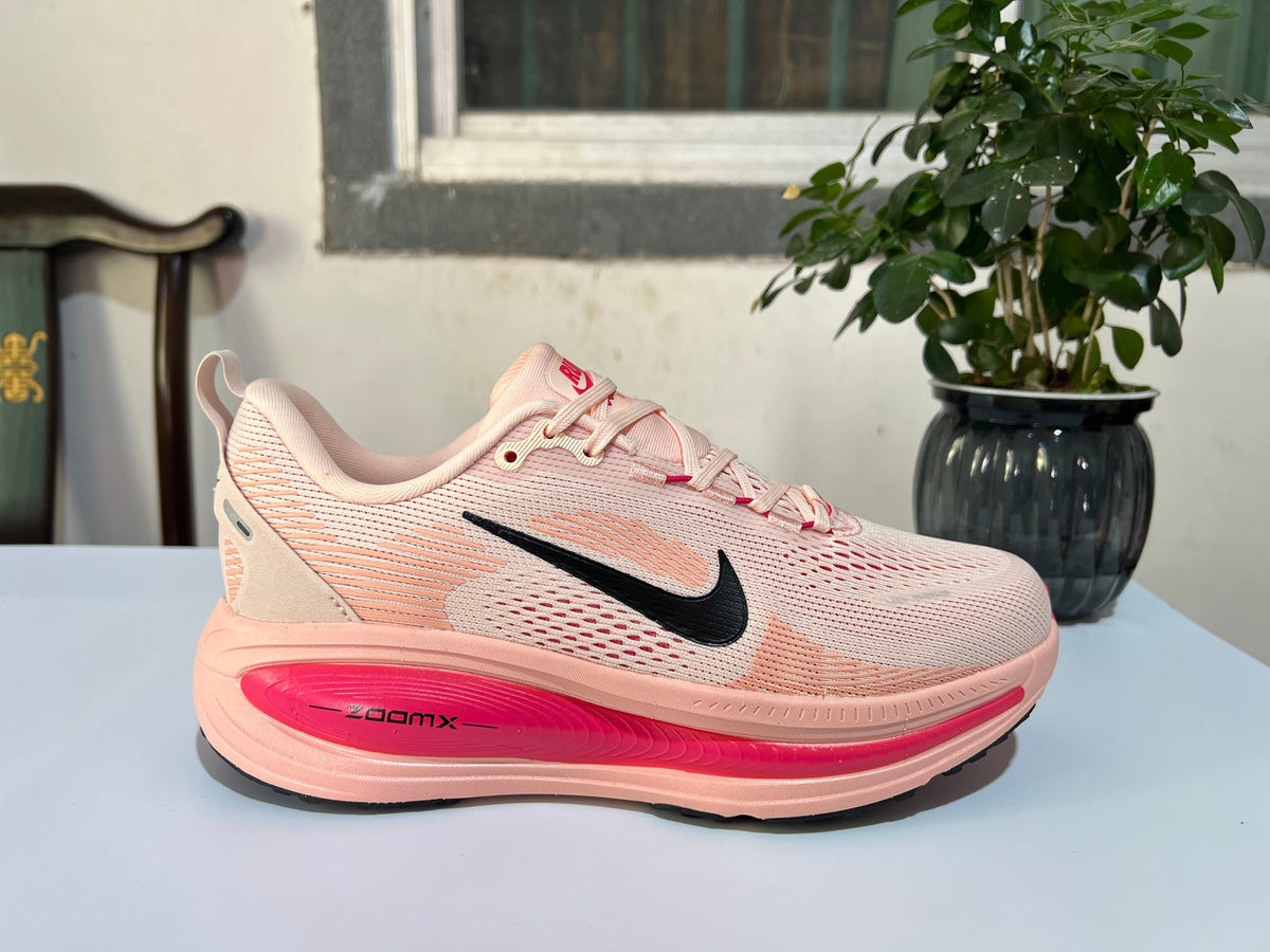 Nike Vomero 18 Running Shoes in Cream Pink - product image from the listing.