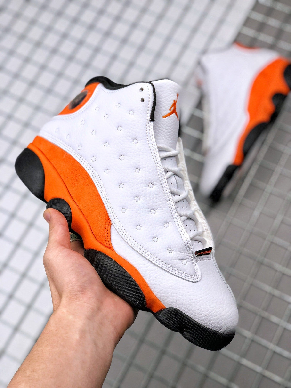 Air Jordan 13 Starfish White Orange Sneakers 414571-108 - product image from the listing.