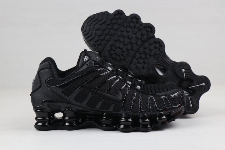 Black and Gold Nike Shox TL Sneakers - product image from the listing.