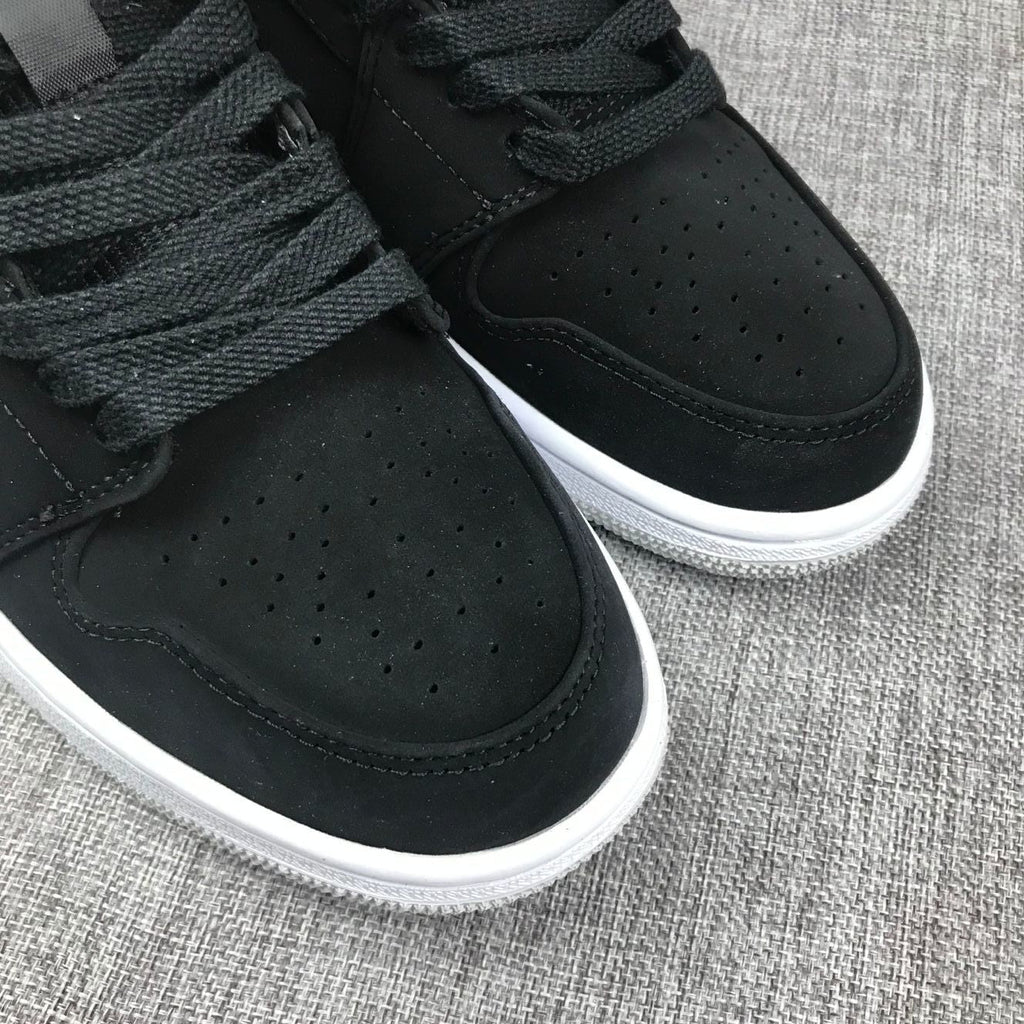 Air Jordan 1 Mid Black, Sneakers in White & Red 554724-060 - product image from the listing.