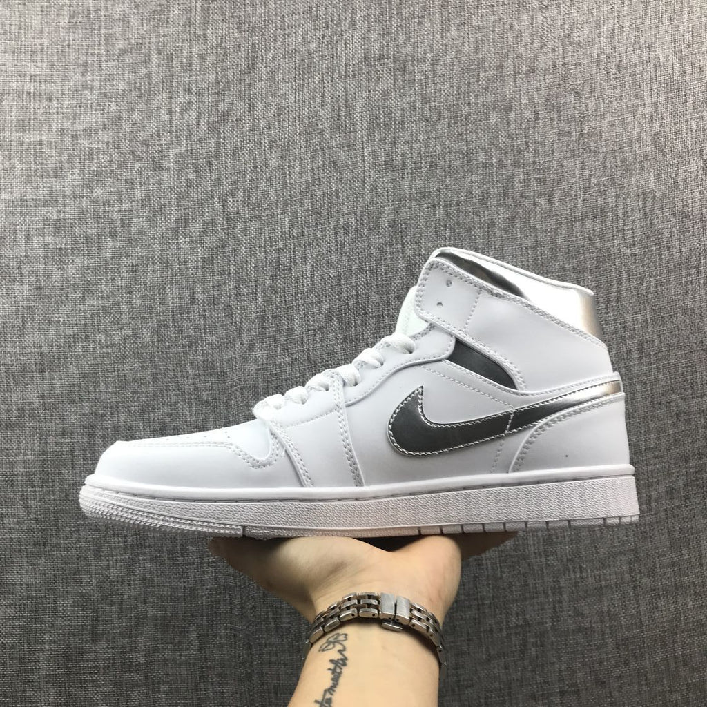 Air Jordan 1 Mid Sneakers in White Silver 554724-105 - product image from the listing.