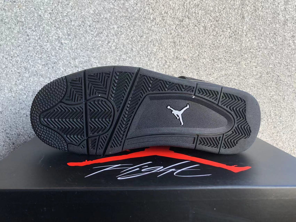Jordan 4 Retro Black Cat Sneakers in Black - product image from the listing.