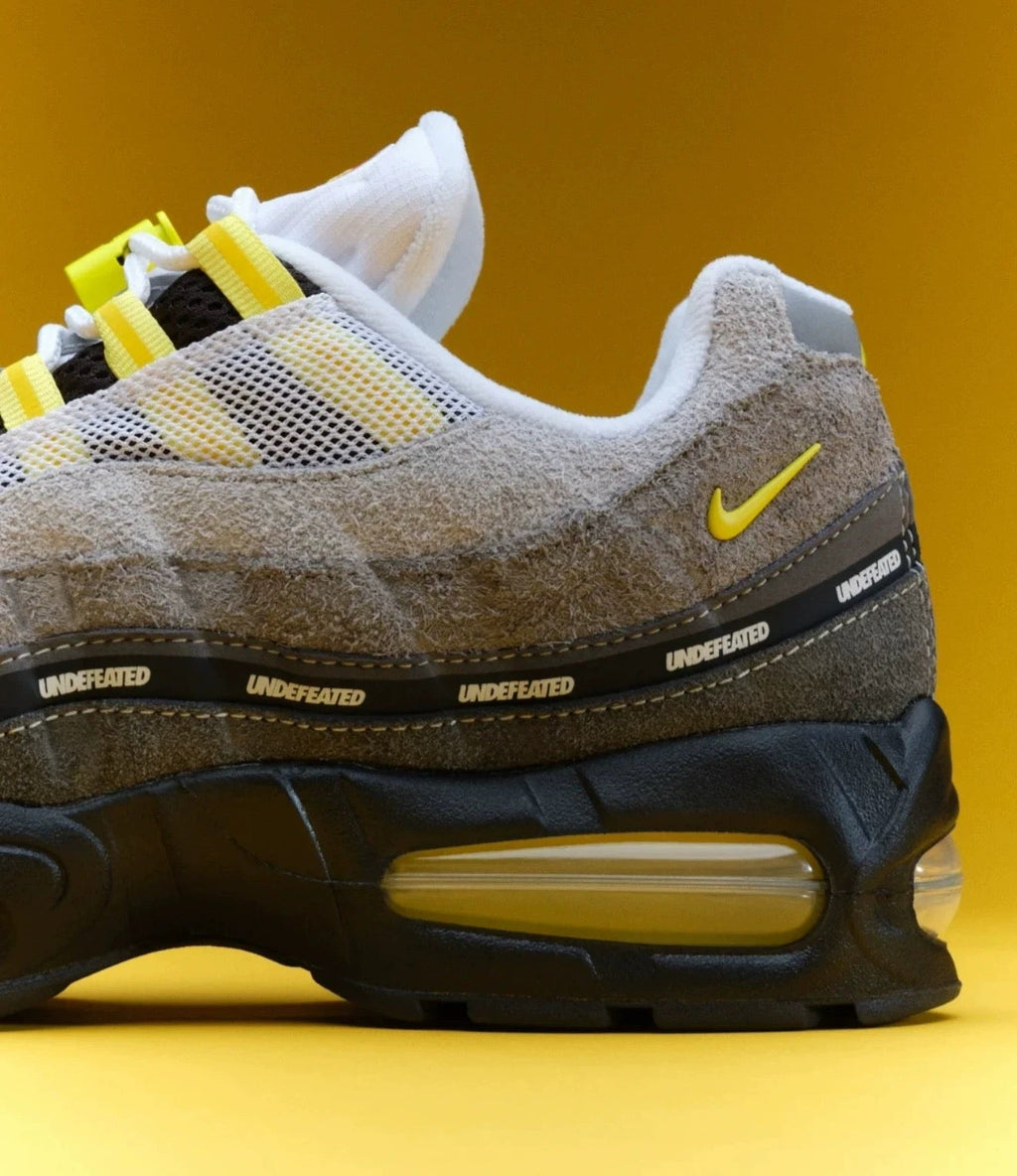 Nike Air Max 95 SP x UNDEFEATED Sneakers in Grey Yellow IB4523-002 - product image from the listing.