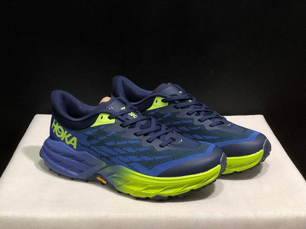 HOKA Speedgoat 5 Trail Running Shoes, in Navy and Lime - product image from the listing.