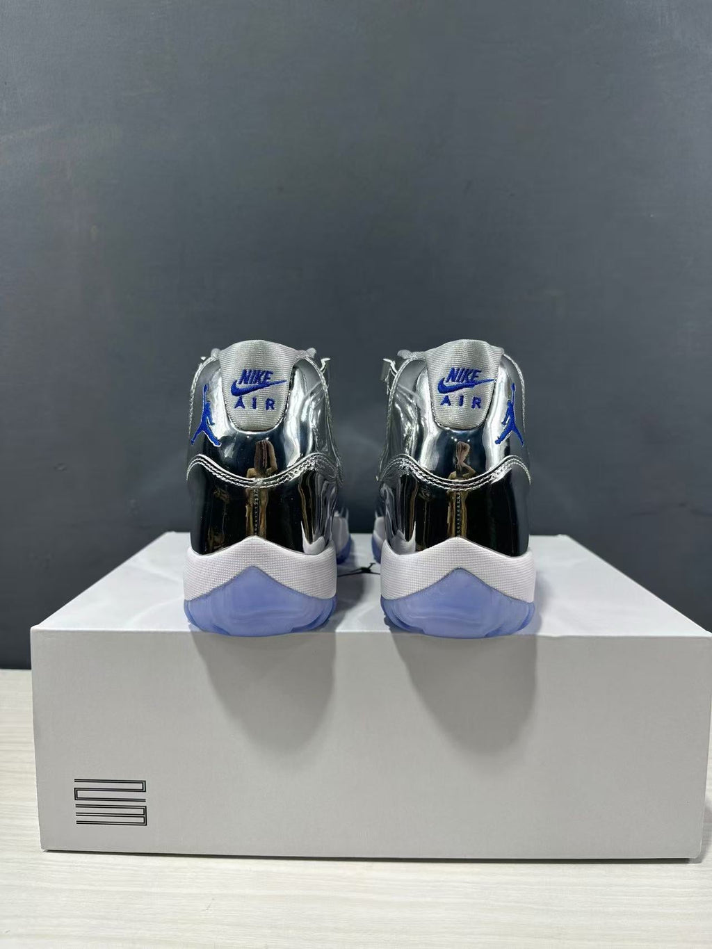 Air Jordan 11 Retro Liquid Silver High-Top Sneakers - product image from the listing.