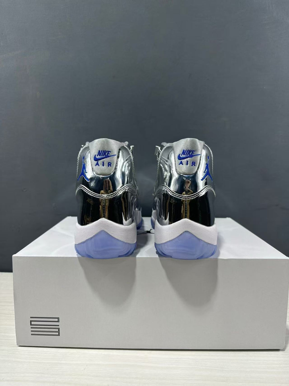Air Jordan 11 Retro Liquid Silver High-Top Sneakers - product image from the listing.