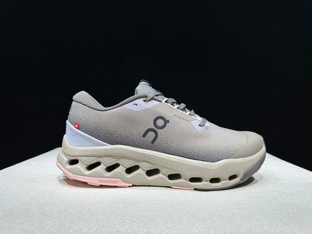 On Cloudsurfer Trail 2 Waterproof Trail Shoes Pink/Brown in Grey - product image from the listing.