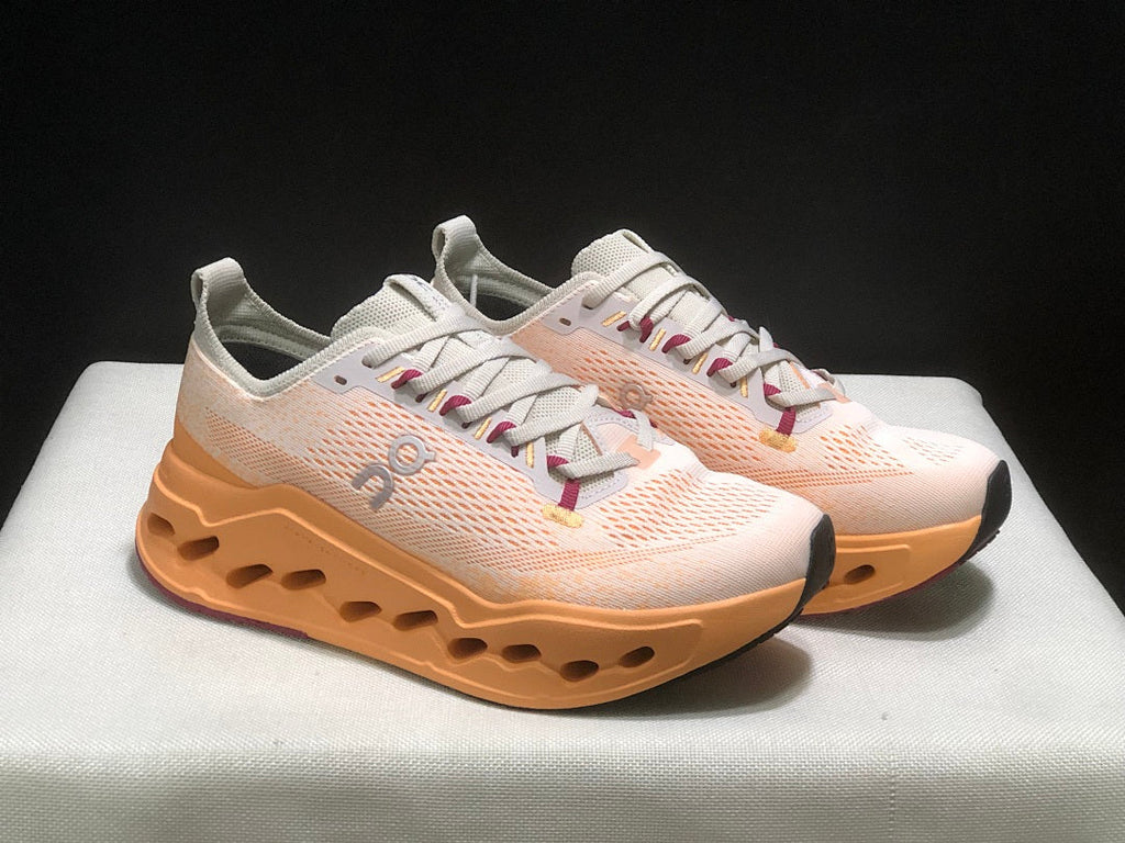 On Cloudsurfer Max Shoes for Running in Pearl and Tangerine - product image from the listing.