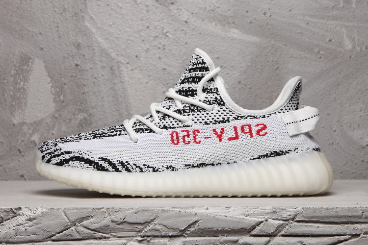 Yeezy 350 V2 Sneakers in Black and White Knit - product image from the listing.