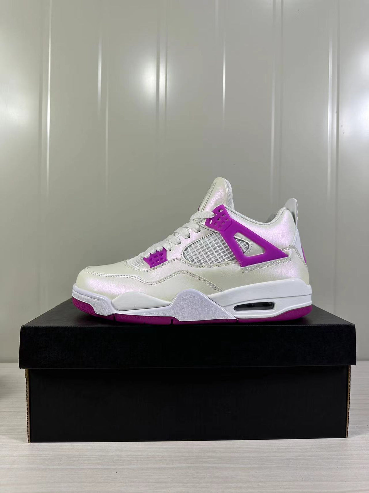 Air Jordan 4 Retro Hyper Violet Sneakers FQ1314-151 - product image from the listing.