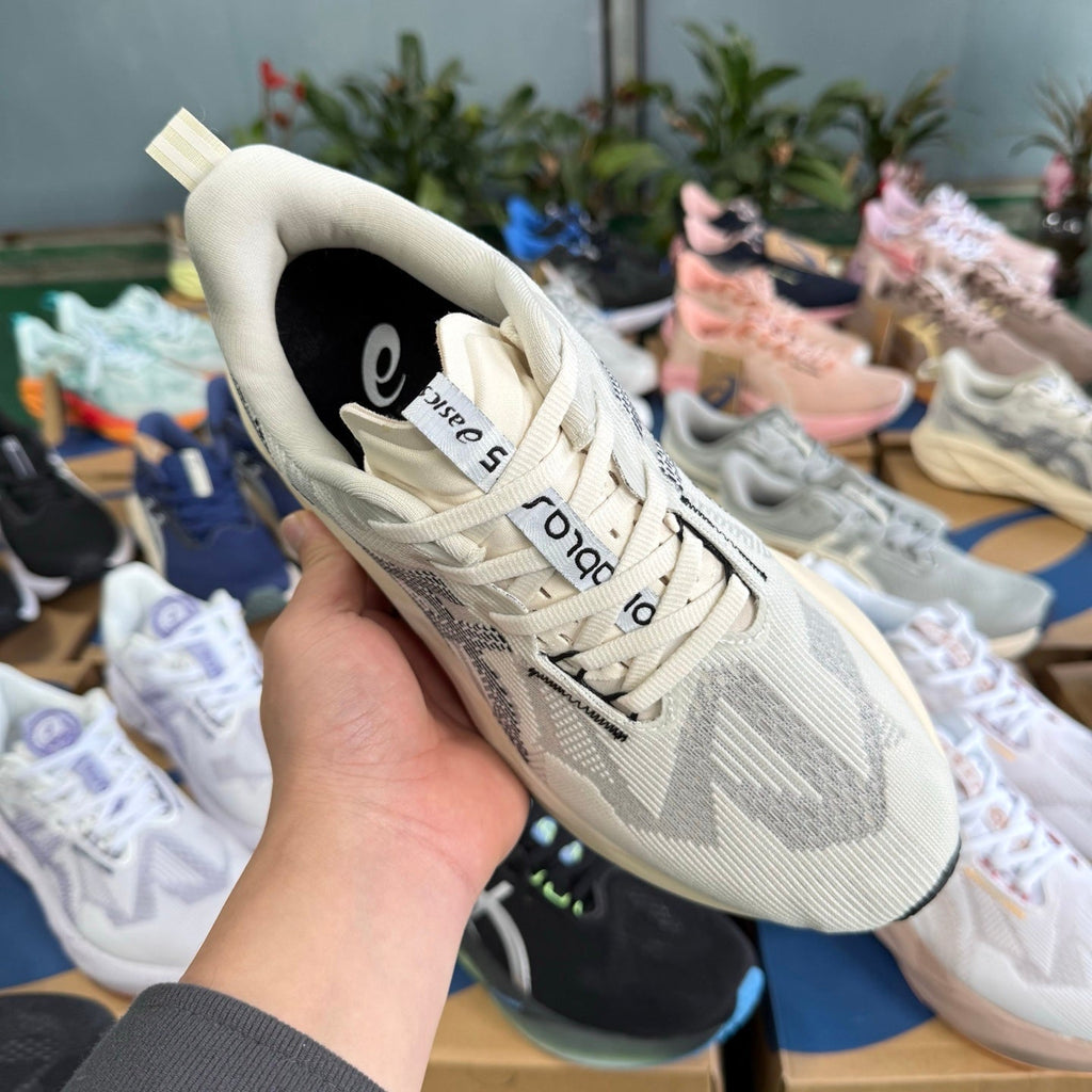 ASICS NOVABLAST 5 LE Running Shoes, in White and Black - product image from the listing.