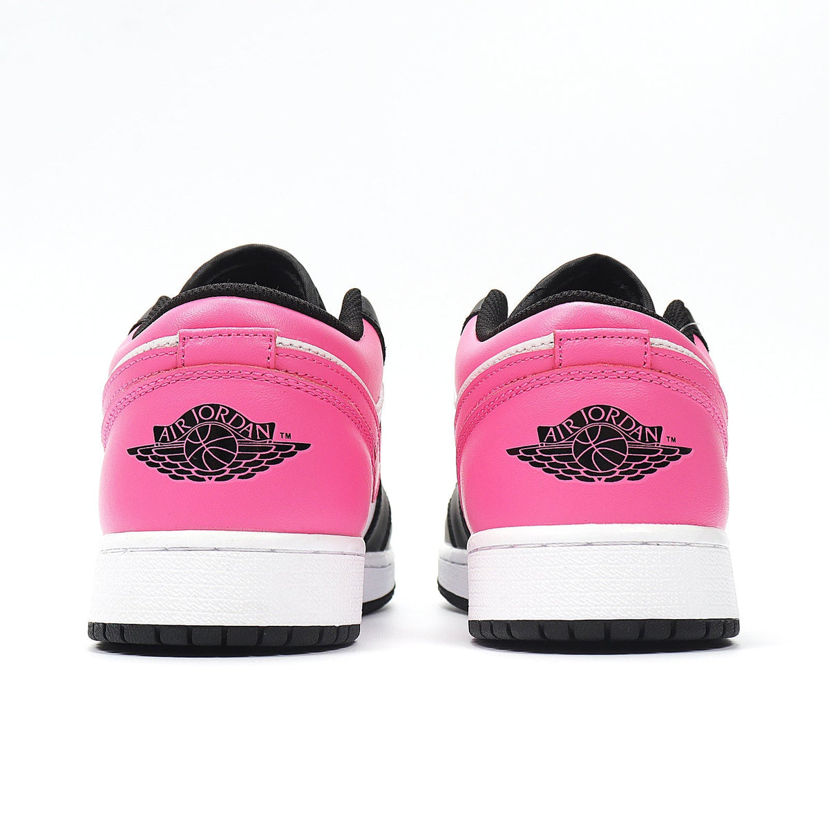Jordan 1 Low Sneakers in Black Pink White 554723-106 - product image from the listing.