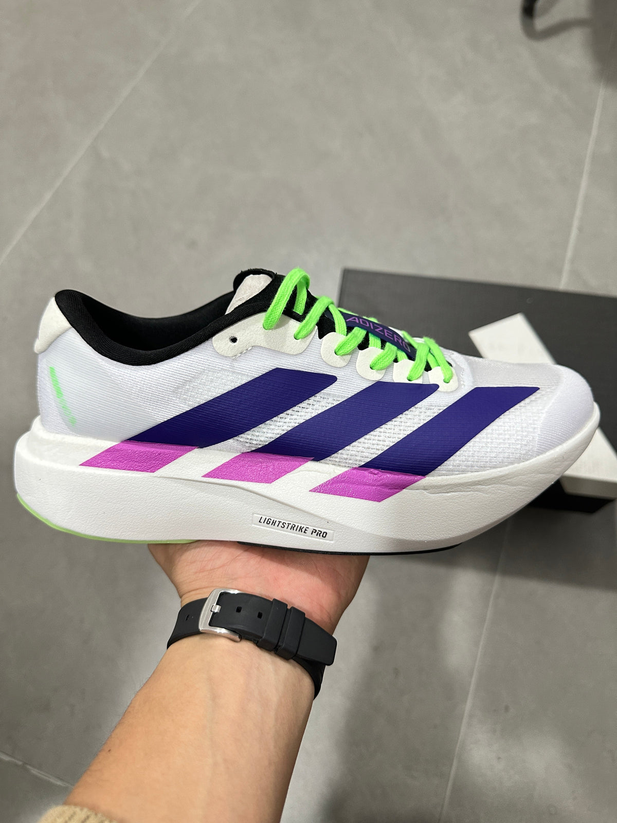 Adizero Lightstrike Pro Running Shoes in White Purple Green - product image from the listing.