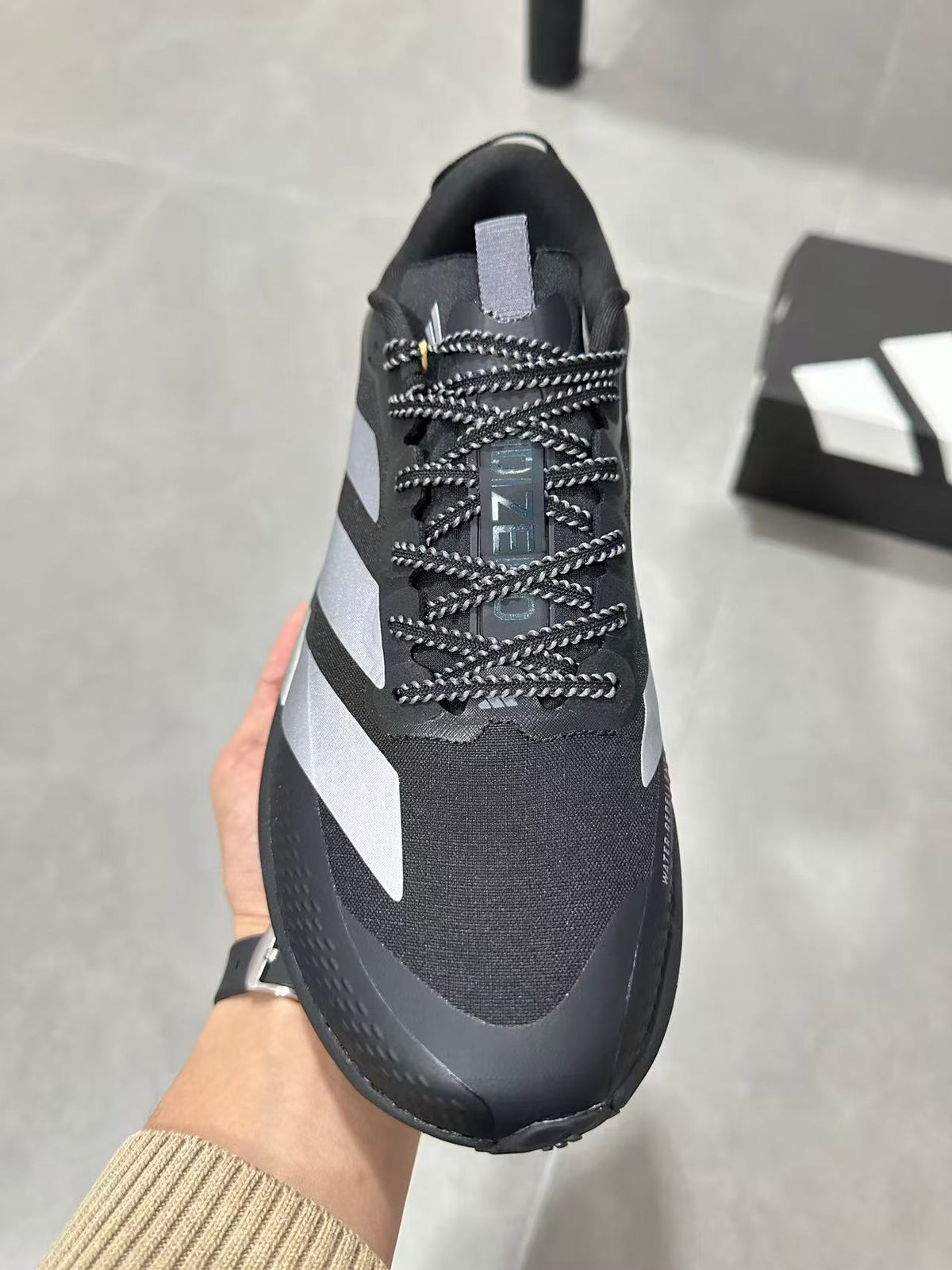 Adidas Lightstrike Pro Black Shoes for Running with White Stripes - product image from the listing.